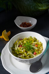 White cabbage with dill and diced bacon