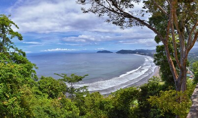 Jaco beach, ocean, city and views, Costa Rica from El Miro Ruins, mansion declared biological corridor, Summer 2022, Central America. - obrazy, fototapety, plakaty