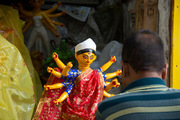 Clay idol of Goddess Durga, under preparation for Bengal's Durga Puja festival at Kumartuli Kolkata. - obrazy, fototapety, plakaty
