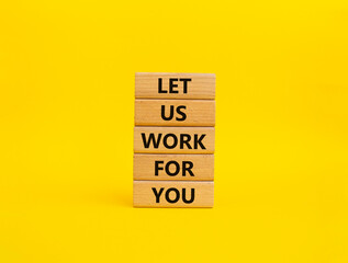 Let us work for you symbol. Wooden blocks with words Let us work for you. Beautiful yellow background. Business and Let us work for you concept. Copy space.