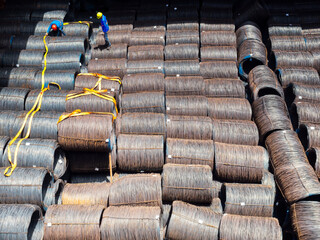 Top view of wire rods in coils stowage into cargo hold of the vessel, Stevedore to prepare for...