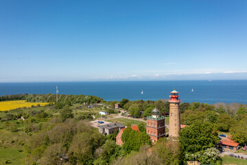 Fototapeta na wymiar The island Ruegen Germany with many rape fields and lighthouse