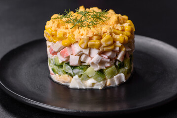 Fresh vegetable salad with corn, pepper, crab, cucumber, eggs and mayonnaise