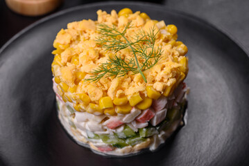 Fresh vegetable salad with corn, pepper, crab, cucumber, eggs and mayonnaise