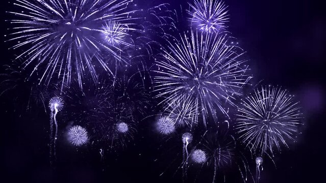 4K. long time seamless loop glowing fireworks lights sky. golden background firework. Sky on Fireworks festival show independence day on 4 of July. fireworks celebration. Holiday, new year, Christmas.
