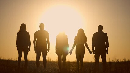 teamwork. team community a holding hands together silhouette at unity sunset. group of people hands. teamwork of workers. team lifestyle in the company running partnership business community hand