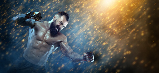 Fototapeta na wymiar Man boxer in boxing gloves in action hit. Sports website header template. Copy space. Athlete of mixed martial arts.