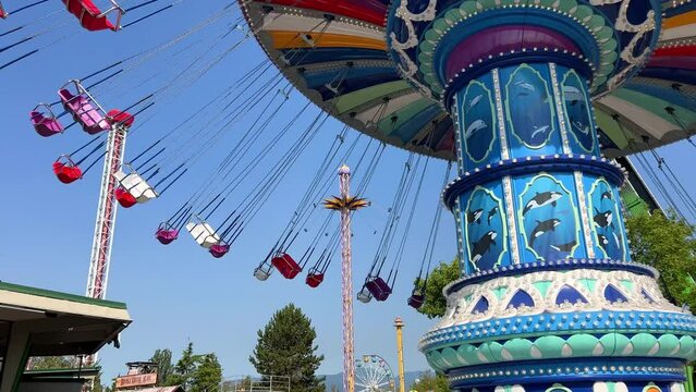 Carousel roundabout. Swinging turning around Attractions in the park and entertainment for adults and children.Extreme and emotional entertainment for swinging. Kaliningrad 09.2022