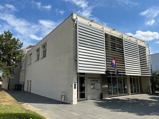 Fototapeta na wymiar Building of the Croatian Cultural Center Vukovar or Croatian Culture Centre - Slavonia, Croatia (Zgrada Hrvatskog Doma u Vukovaru ili Hrvatski Dom Vukovar - Slavonija, Hrvatska)