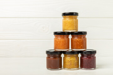 Jar of honey. Fruit honey with berries and nuts.Useful fortified beekeeping product for health and beauty.Cream honey.Vegetarian diet organic product.Copy space. place for text