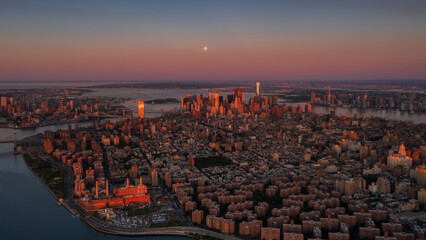 Aerial view of New York with a full moon at sunrise