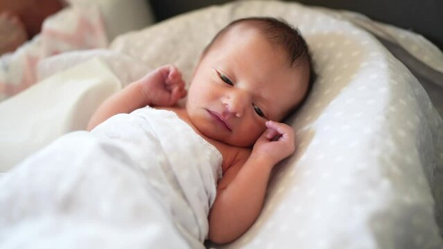 baby newborn. little baby a newborn 1 month of life lies in bed in the maternity hospital. happy family kid dream concept. close-up baby indoors. beautiful cute girl lies lifestyle at home