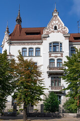 Riga Art Nouveau or Jugendstil of beautiful house with weathercock on turret, balconies and stucco decorations on the Elizabetes street, Riga. Latvia
