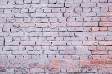 Texture of a brick wall. Background from bricks of bright color. Solid brick texture. Beautiful and bright camp