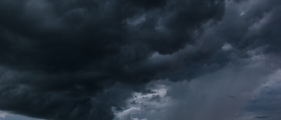 Obraz premium The dark sky had clouds gathered to the left and a strong storm before it rained.Bad weather sky.