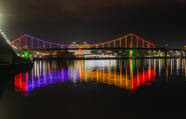 Fototapeta na wymiar KIEV, UKRAINE - JANUARY 6, 2020: PARK BRIDGE (pedestrian bridge) ILLUMINATED BY NIGHT