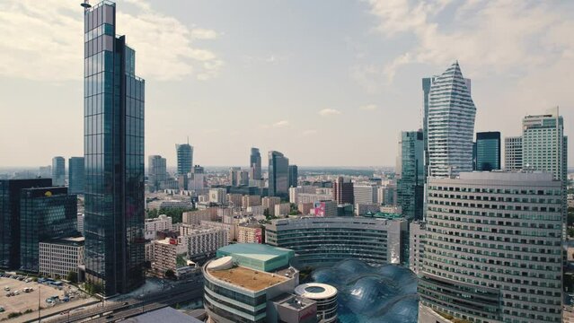 Birseye view of the center of Warsaw Poland with modern glass high-rise buildings and Zlote Tarasy shopping center. Horizontal drone shot. High quality 4k footage