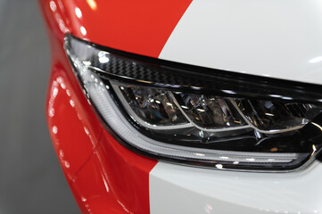 Modern backlights of the car. The headlight of modern prestigious car close-up. Beautiful headlights of a car.