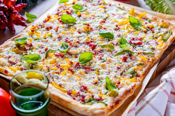 Delicious Flammkuchen Pizza. Traditional Tarte Flambee with Creme Fraiche, Cream Cheese, Bacon and...
