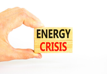 Global energy crisis symbol. Concept words Energy crisis on wooden blocks. Beautiful white table white background. Businessman hand. Business global energy crisis concept. Copy space.