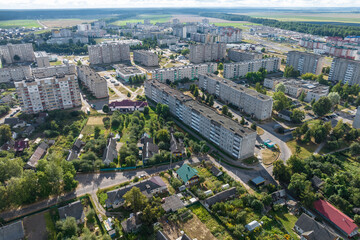 Fototapeta premium aerial panoramic view from a great height of a small provincial town with a private sector and high-rise apartment buildings