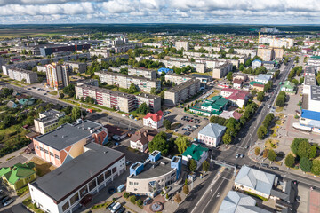 Fototapeta premium aerial panoramic view from a great height of a small provincial town with a private sector and high-rise apartment buildings