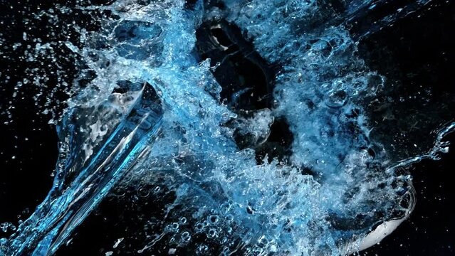 Super Slow Motion Shot of Splashing Water on Black Background at 1000 fps.
