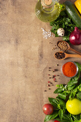 Fresh vegetables with herbs and spice at background table. Natural healthy homemade food concept