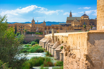 Cordoba, Spain. Roman Bridge on Guadalquivir river and The Great Mosque (Mezquita Cathedral) in the city of Cordoba, Andalusia.