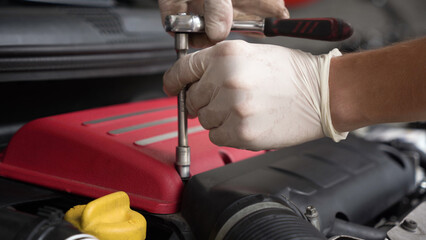 auto mechanic repairs car engine. car service. close-up.
