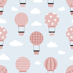 Childish seamless pattern with hot air balloons in sky. Hand drawn airship. Pink and blue colors. Vector illustration.