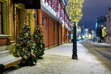 Christmas decoration of streets. The snowstorm.