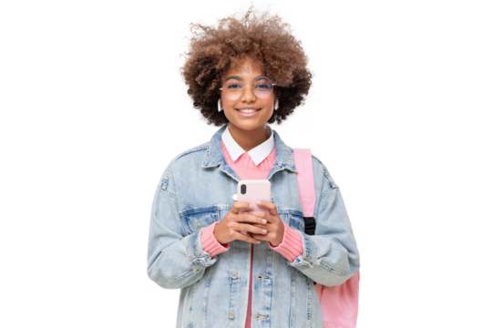 African american smiling female college student with afro hairstyle, trendy glasses and pink backpack holding phone, looking at camera