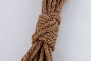 Closeup of an 8mm jute rope coil isolated on a white background