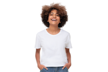 Front view of laughing african teen girl standing with hands in pockets, wearing white tshirt with copy space
