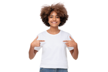 Smiling african girl pointing at her blank white tshirt with both index fingers, copy space for your ads, isolated