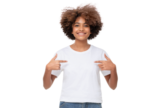 Smiling african girl pointing at her blank white tshirt with both index fingers, copy space for your ads, isolated