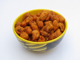 Masala peanuts in a bowl on white background 