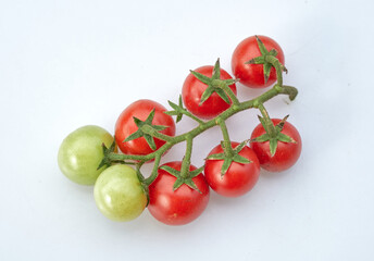 Bunch of cherry tomatoes on white background.