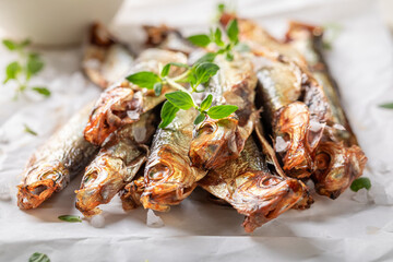 Salty smoked sprats as a healthy snack.