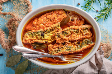 Fresh roasted mackerel in vinegar marinade with spices.