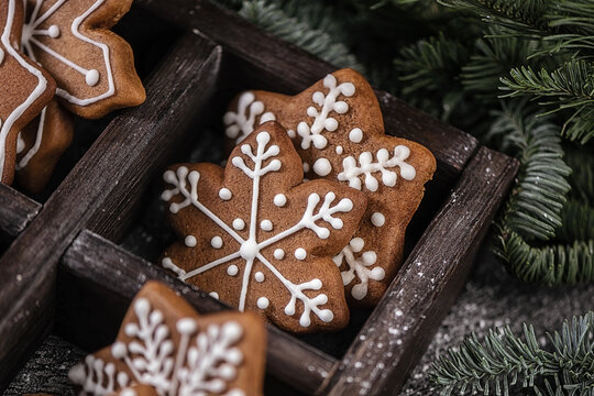 Various christmas gingerbread stars on wooden background