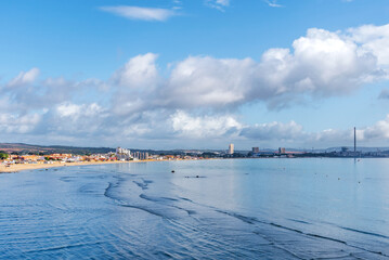 View of the Rinconcillo beach in Algeciras, with the industrial zone of Los Barrios in the background. - obrazy, fototapety, plakaty