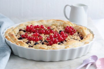 Tasty fruit pie with berries on table