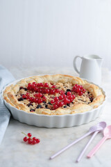 Tasty fruit pie with berries on table