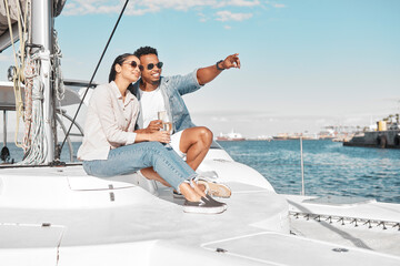 Couple, love and yacht with a man and woman out at sea or on the ocean for romance and a luxury date or cruise. Happy, trust and care with a young male and female on a boat in the water together