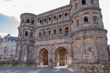 Trier October 2021: The Porta-Nigra, Latin for Black Gate, is an earlier Roman city gate built from...