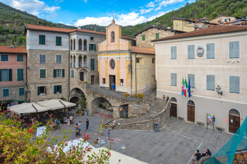 View of the main square of Apricale, a small ancient village of stone-made houses above the Ligurian Alps (Northern Italy), close to the borders between Italy and France.