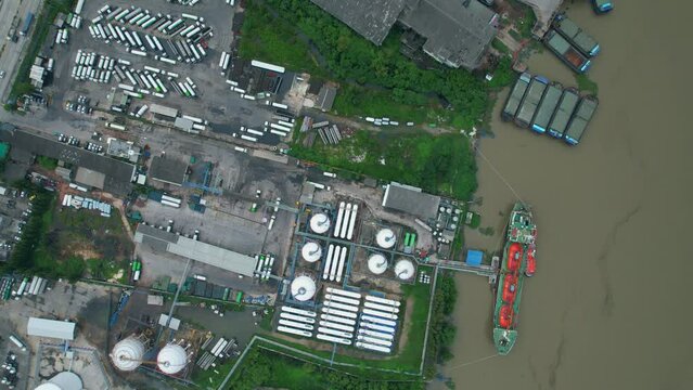 Drones are flying over gas plants, gas tanks, trucks and gas tanker for transporting gas. energy industry
