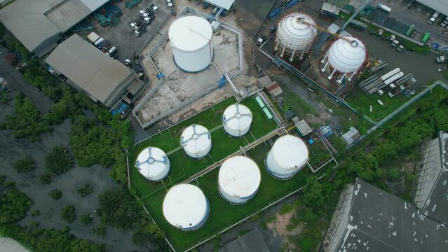 4K : Aerial view from drone flying over a storage tank industry (LNG or LPG), gas refinery, gas factory plant. fuel industry
